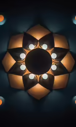 some lights are in the dark and one is a light with four