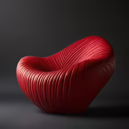 an abstract sculpture consisting of a curved chair and a round red cushion
