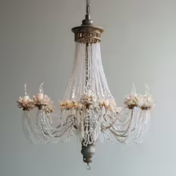 a chandelier with flowers hanging from it