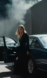 a young blond woman in an elegant black dress