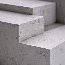 there are cement slabs that are arranged in order to form one