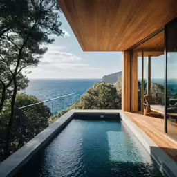 this large swimming pool has the ocean in the background