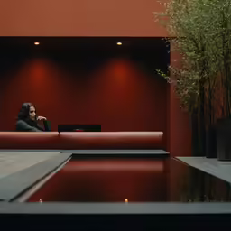 a man that is on a couch by himself