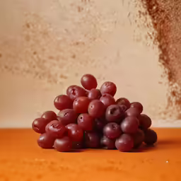 a close up view of grapes on the ground