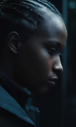 the black woman has dark hair with a pony tail