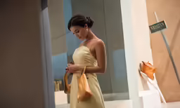 a woman standing on the outside of an entrance