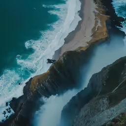 a beach that has water coming from it with large waves
