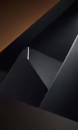 a black counter top sitting inside of a room