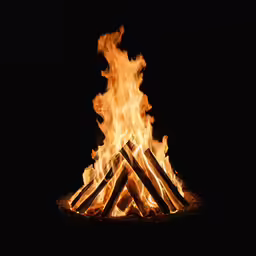 a pile of logs with flames at the ends