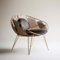 a black chair sitting next to a gray wall