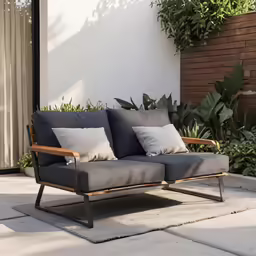 the wood and grey chair is near a wall