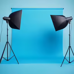 some photography equipment set up in front of a backdrop