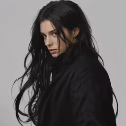 a woman wearing black has long hair