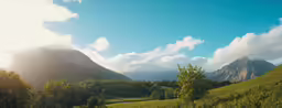 a picture of mountains with clouds in the sky