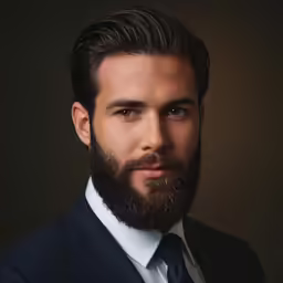 a man with a beard and tie