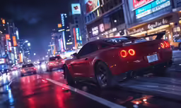 a red car driving down the road next to tall buildings