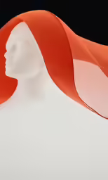 an orange scarf covering a white dummy with an image of a woman