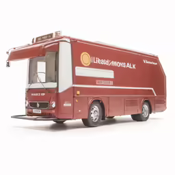 an red tour bus on white surface with no wheels