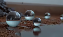 some shiny balls sitting on top of a brown table