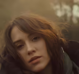 a close up photo of a woman wearing a hoodie