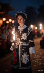 a woman holding a lit torch in her hand