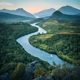 an aerial view of a river surrounded by mountains
