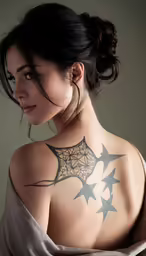 a woman has her back turned to show the intricate motif