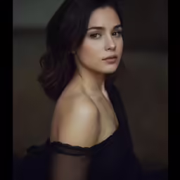 a woman with a lacy top posing for a picture