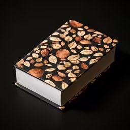 an open black book with nuts on the front