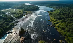 an aerial view of a river that flows through a lush green valley