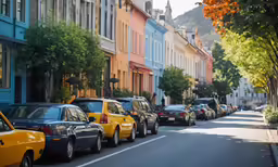 this is an image of many cars parked on the side of the road
