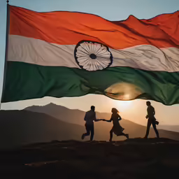 a couple of people walk underneath a indian flag