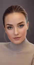 a beautiful young lady with blonde hair wearing a turtle neck