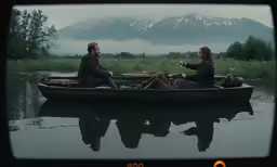 two people in a row boat on the water