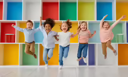 a bunch of kids jumping up in the air