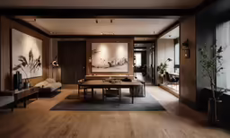 a living room and dining area with large paintings