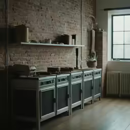 a kitchen with brick walls and an oven with the hood off