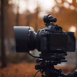 an image of a camera with an attached lens