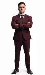 a man in a suit and tie standing with his arms folded