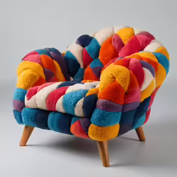 a colorfully colored chair with wooden legs and feet