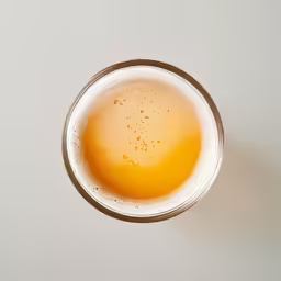 a glass with some liquid inside of it