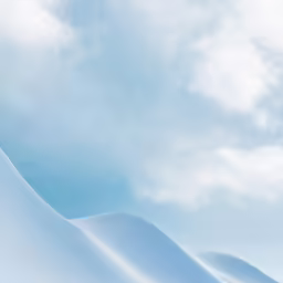 a skiier with a powdered mountain behind him