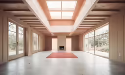 the inside of an empty room with glass doors