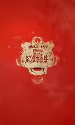 the red wall has a skull and a clock on it