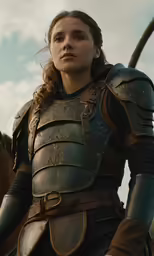 a female in armor holding a long rifle
