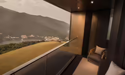 a chair sitting on the side of a balcony