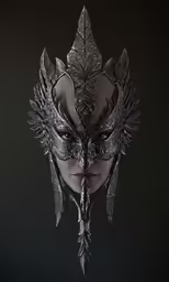 a close up of a mask with leaves