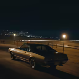 car parked on the side of the road at night