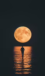 a person in a body of water with the moon in the distance