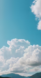 a big cloud filled sky with some blue sky in it